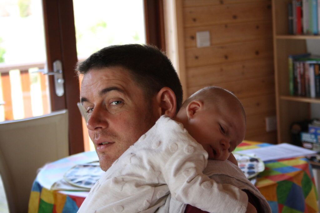 spinally injured dad carrying baby